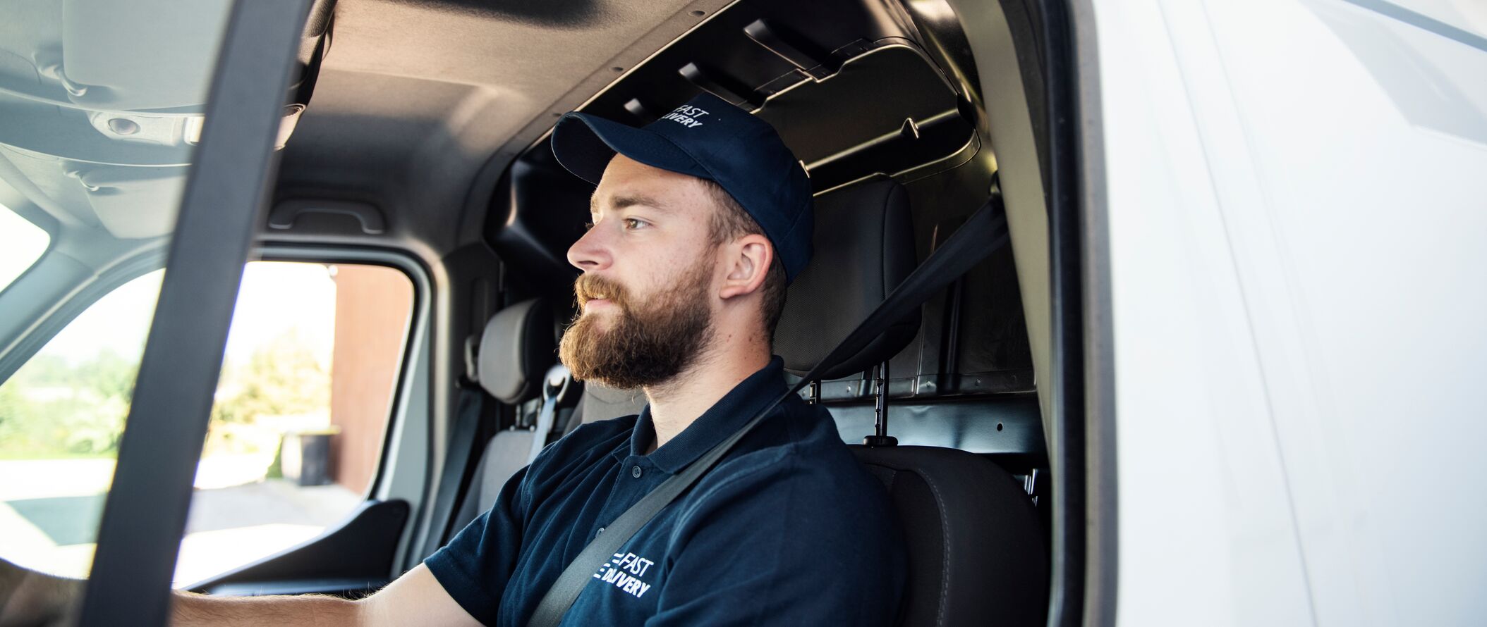 Banner-dist-delivery-man-sitting-in-a-delivery-van.jpg