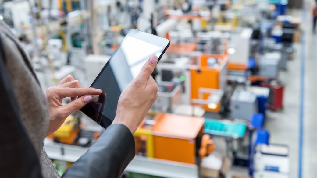 Female Supervisor using tablet